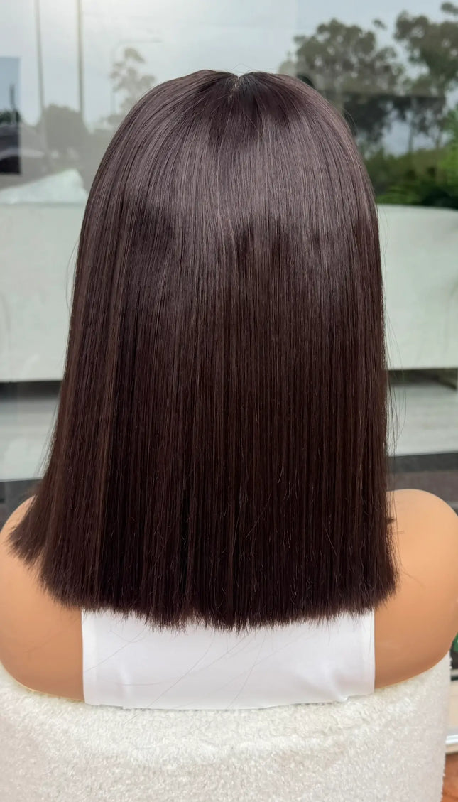 back view showcasing straight dark brown hair. lacefront synthetic - heat safe. 