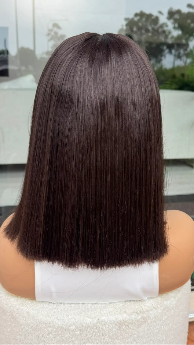 back view showcasing straight dark brown hair. lacefront synthetic - heat safe. 