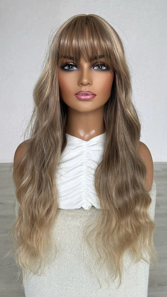 long fringe wig, soft honey blonde with middle part.