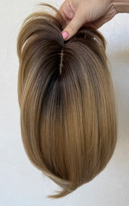 synthetic topper top view, showing hairline and part, dark root