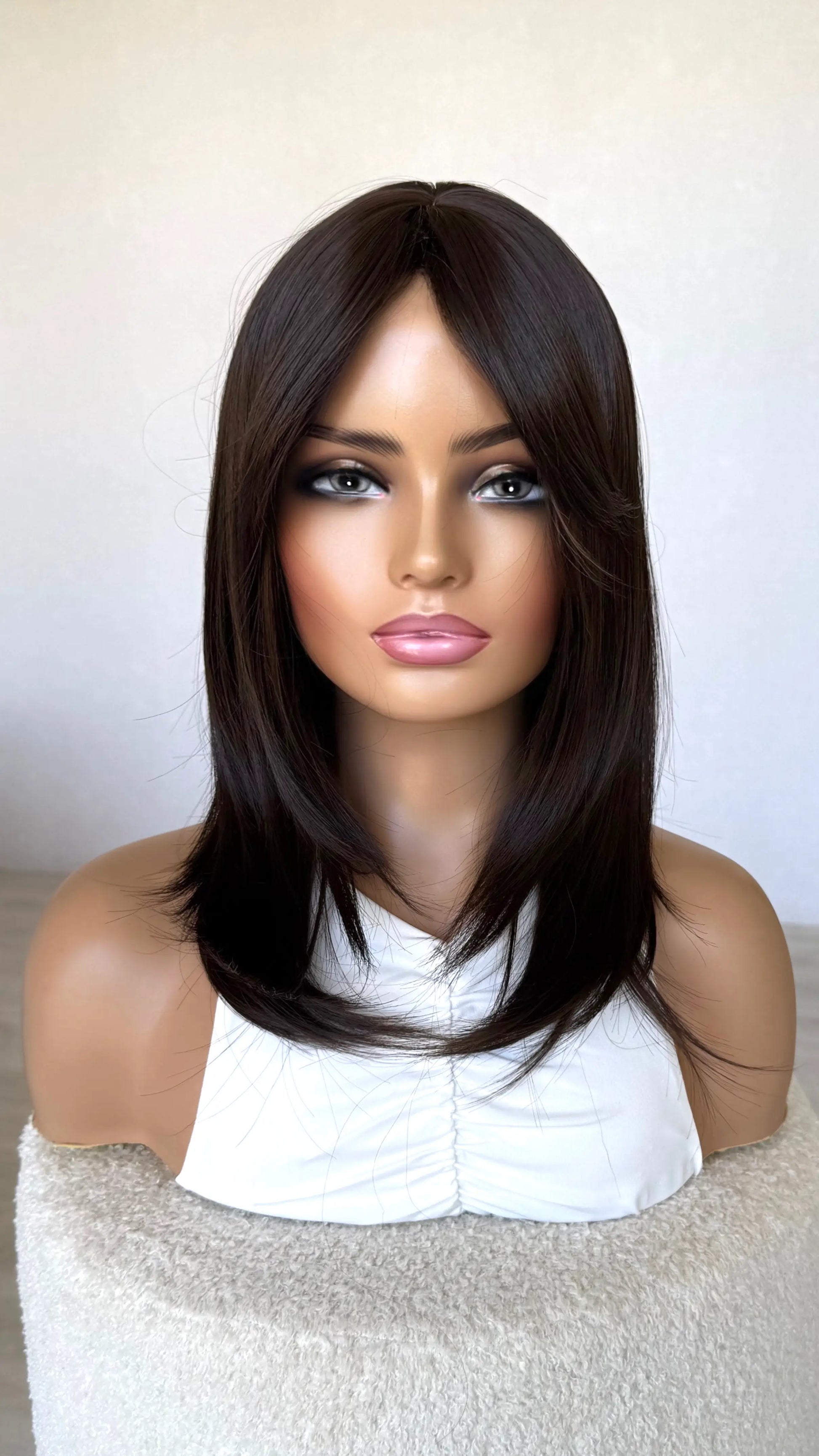 layered brown hair, middle part with curtain bang fringe. heat safe synthetic hair australia.