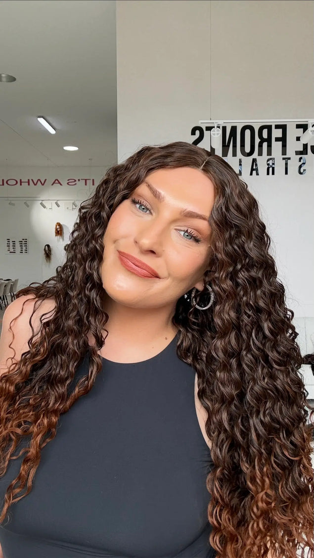 warm brunette ombre with chesnut ends, glueless wig cap for easy daily wear. middle part with long curly hair.