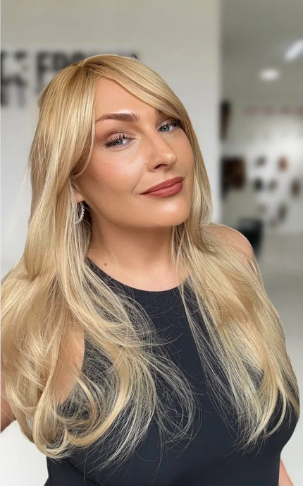 warm golden blonde with layers and middle part. very gold warm blonde colour.
