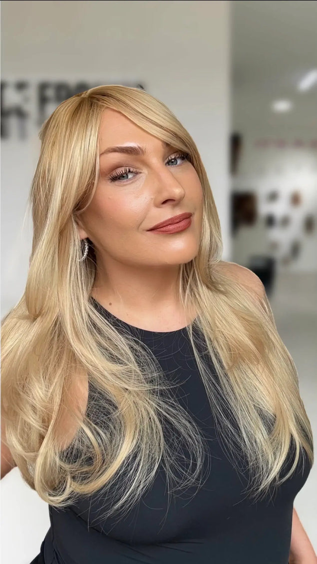 warm golden blonde with layers and middle part. very gold warm blonde colour.