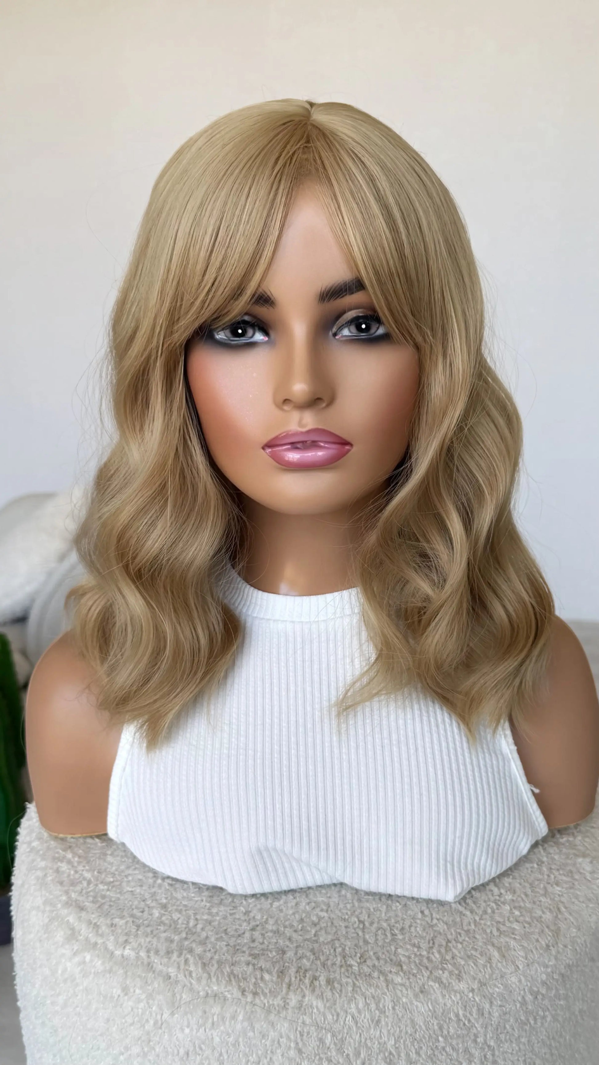 wavy blonde with longer fringe, glueless heat safe synthetic wig australia, honey blonde, middle part.