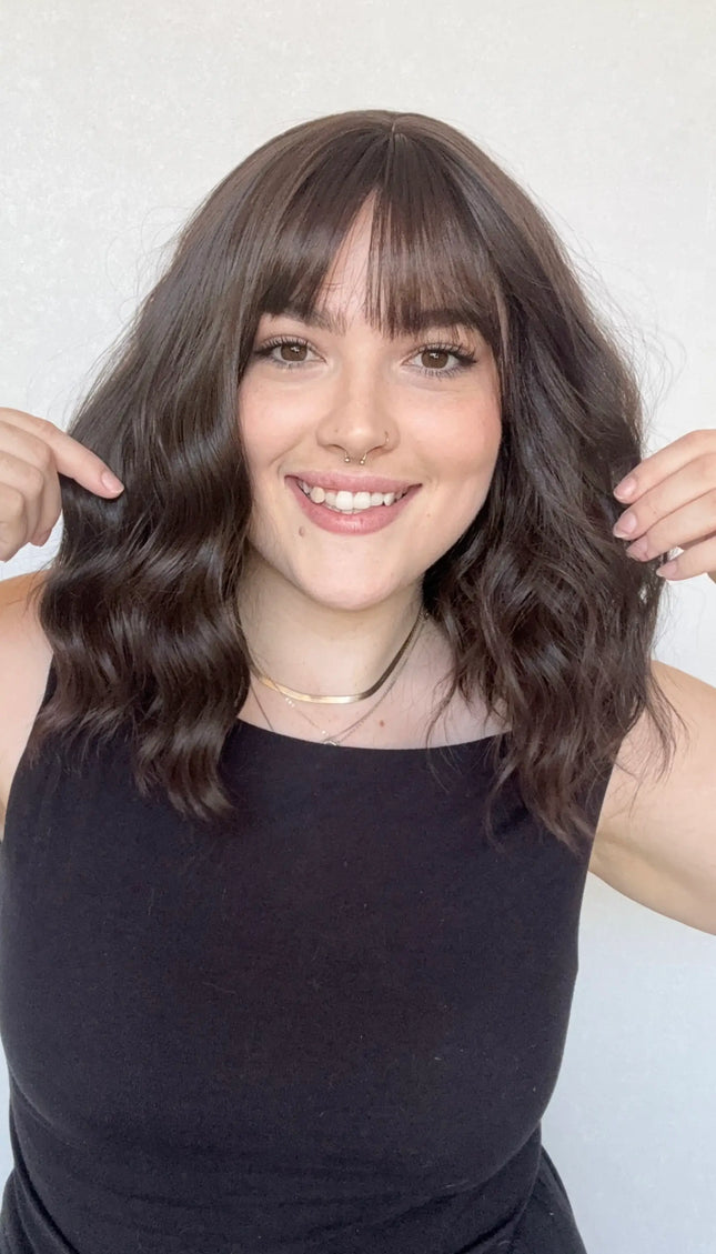 realistic wavy brunettte synthetic wig with fringe. for hairloss, alopecia, daily wear.
