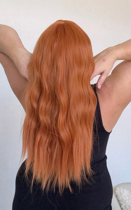 wavy bright ginger hair from back, heat safe synthetic wig australia.