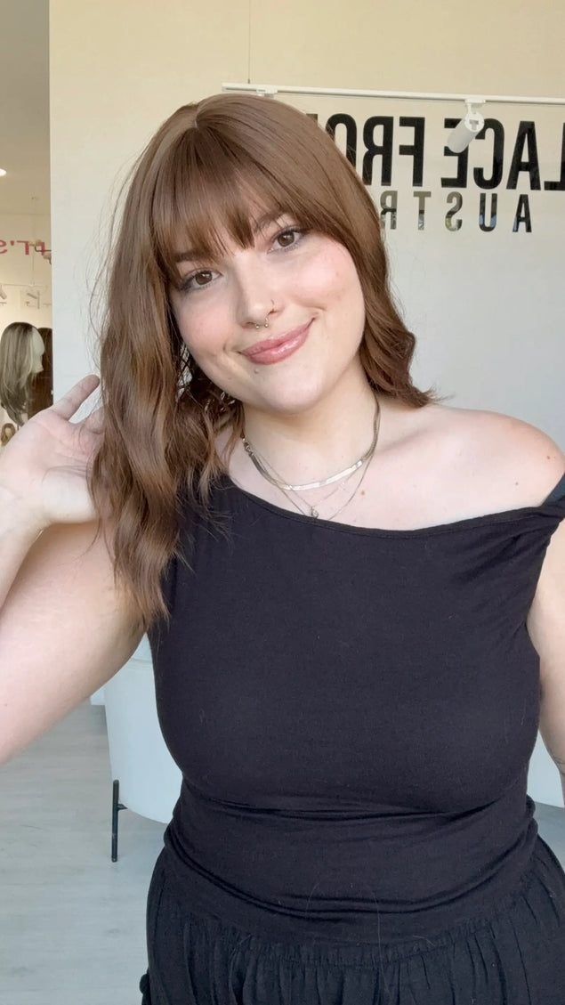glueless synthetic wig australia, wavy brown hair, long bob with middle part and fringe.