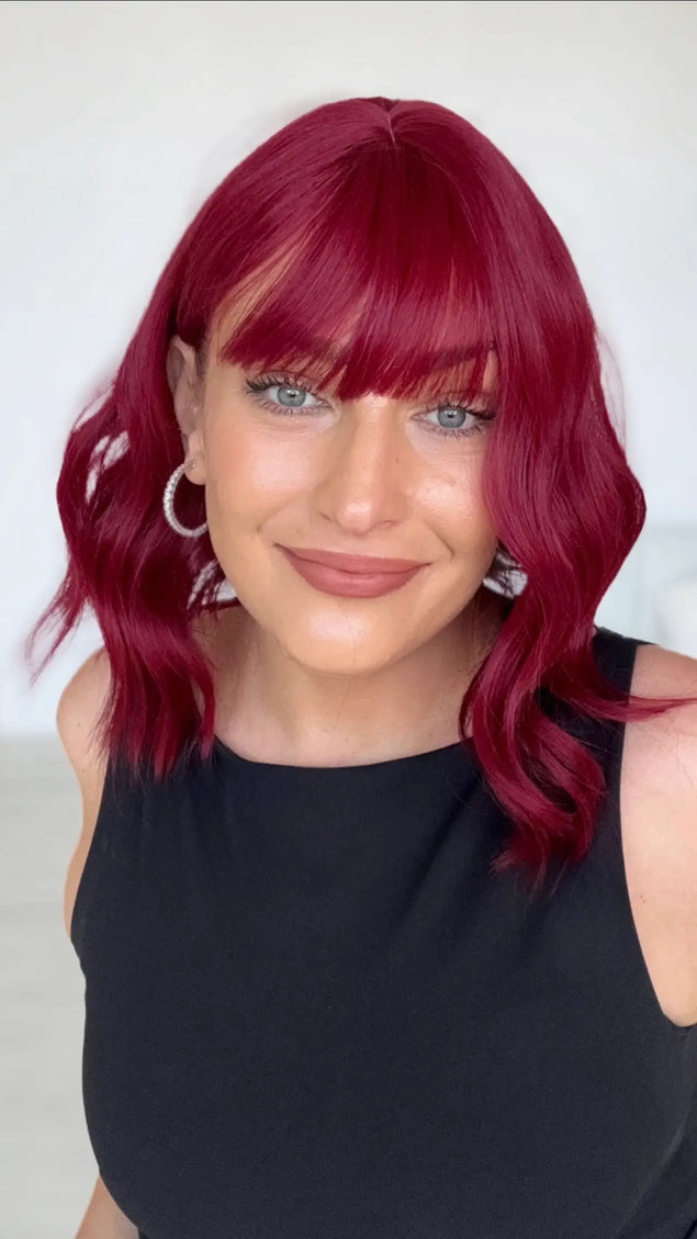 collarbone length red hair wavy wig with middle part and long fringe. glueless wig for easy wear.
