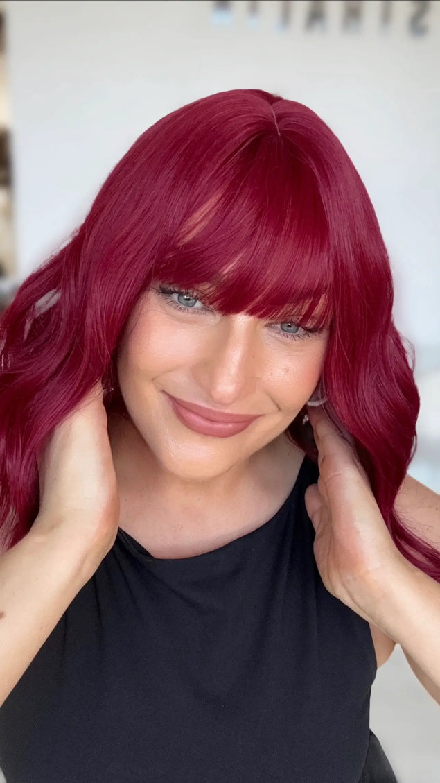 glueless cap deep red wig with wavy collarbone length hair, middle part and long fringe.