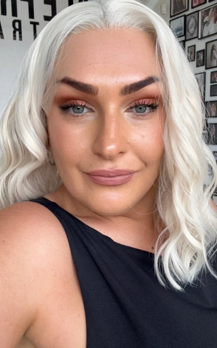 wavy lace front synthetic wig, white blonde hair, middle parting.