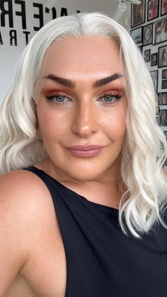 wavy lace front synthetic wig, white blonde hair, middle parting.