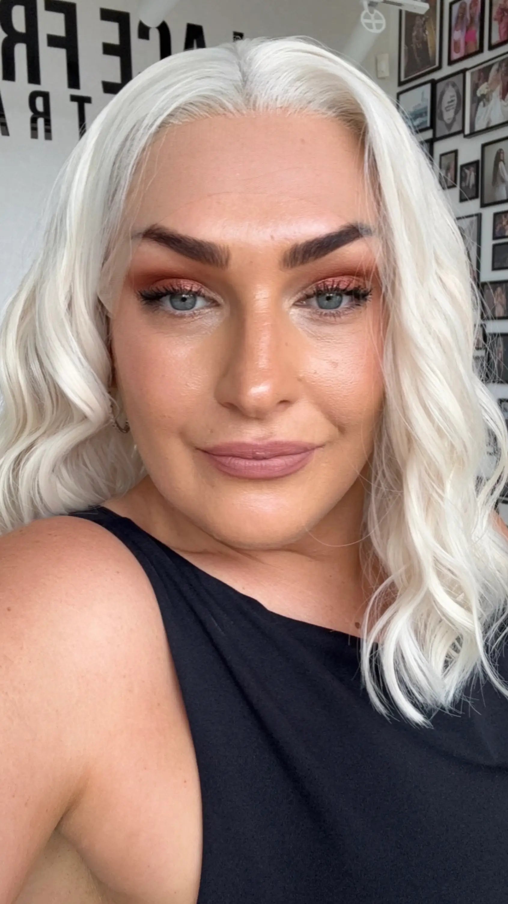 wavy lace front synthetic wig, white blonde hair, middle parting.