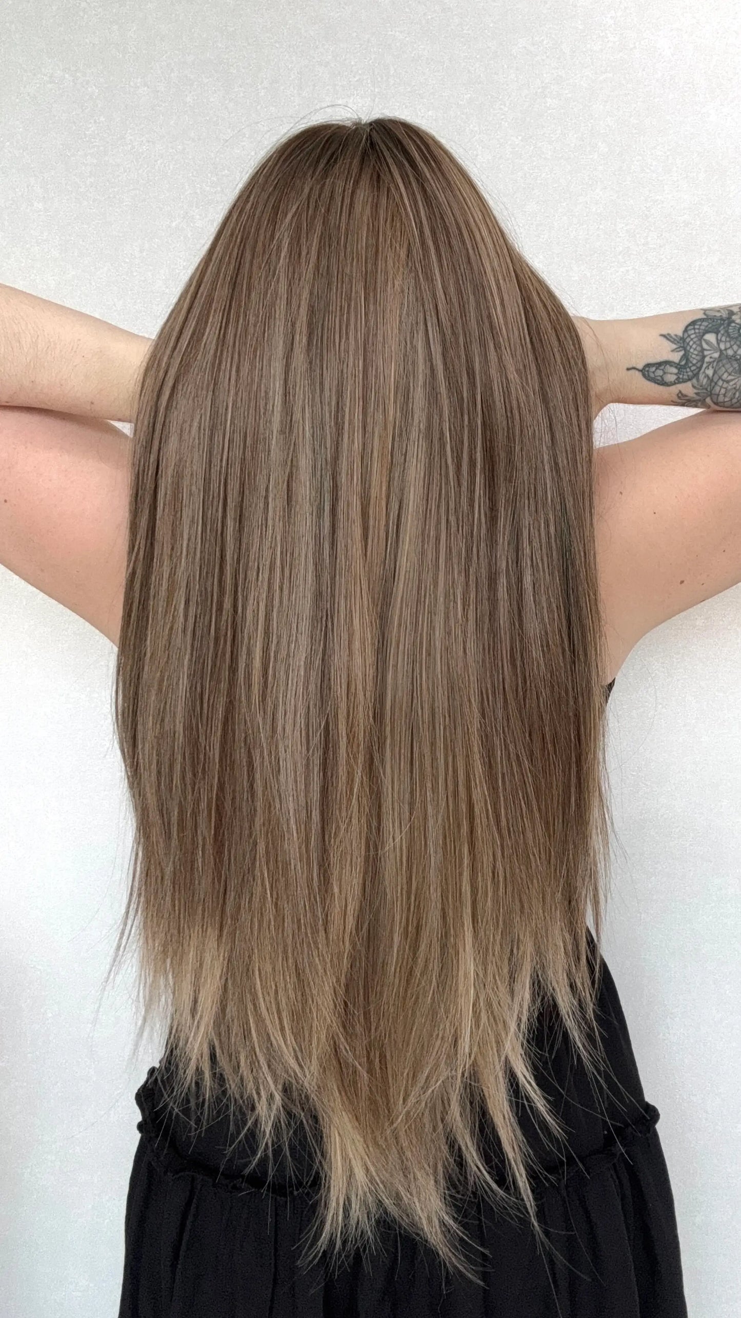 holding hair back view, long synthetic wig australia.